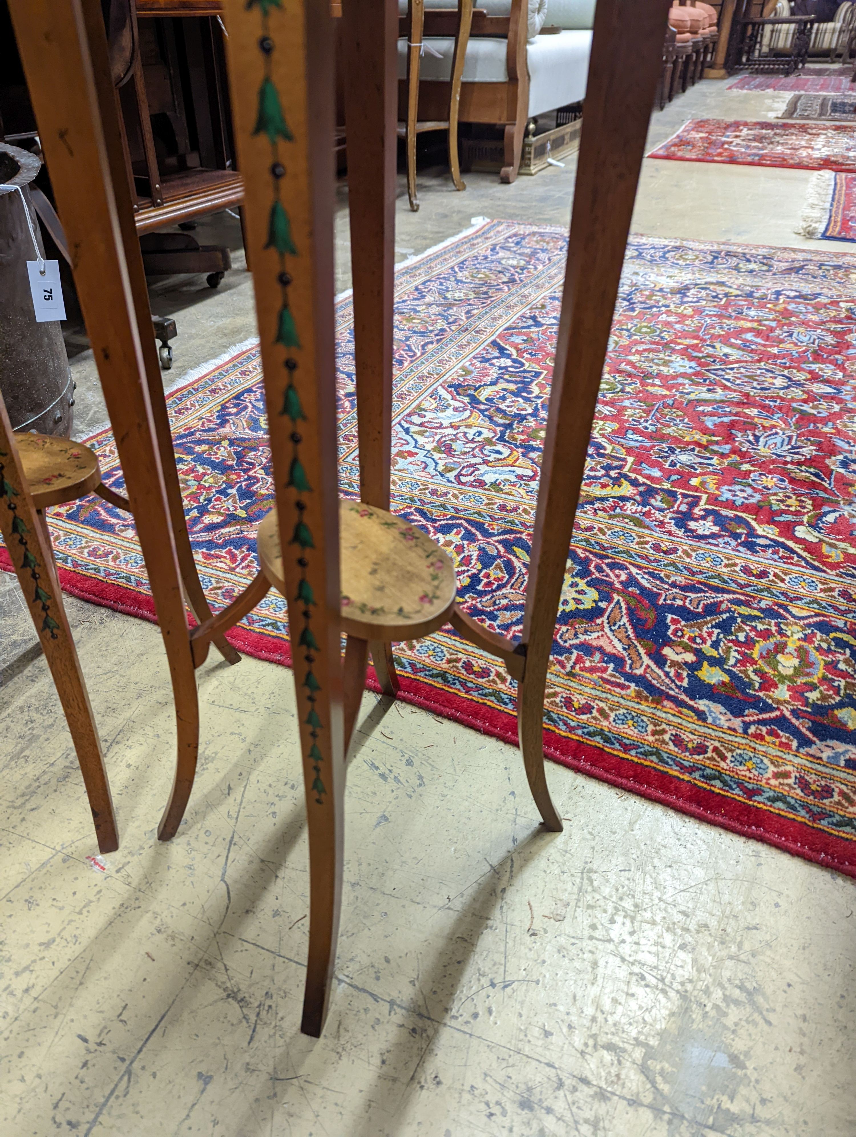 A pair of Sheraton style oval painted satinwood occasional tables, width 31cm, depth 26cm, height 71cm